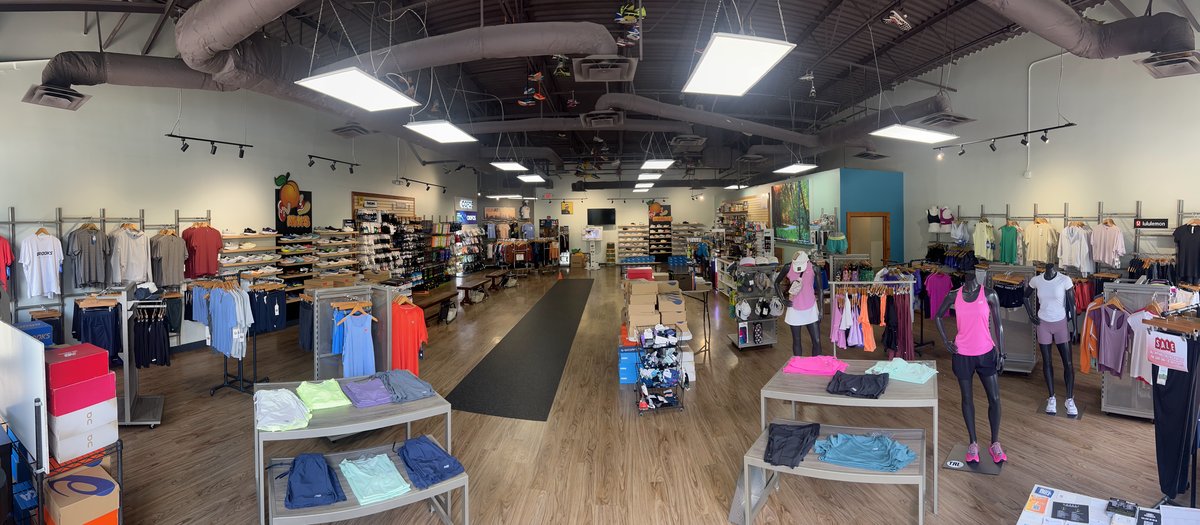 Interior of Big Peach Running Co. Alpharetta, showing the fitting area, shoe wall and apparel displays